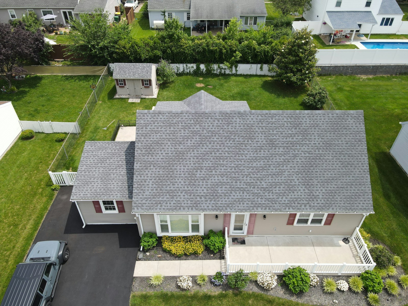 Wide aerial view of a residential roof with architectural asphalt shingles